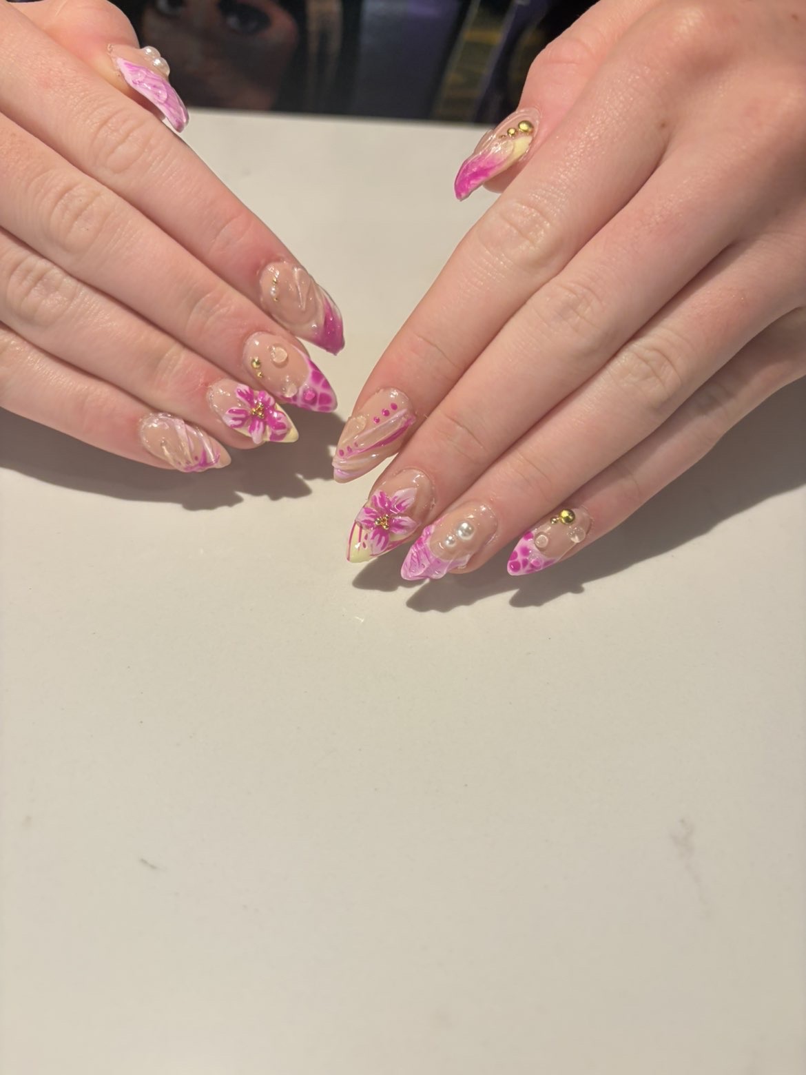 Nude and pink floral stiletto nails