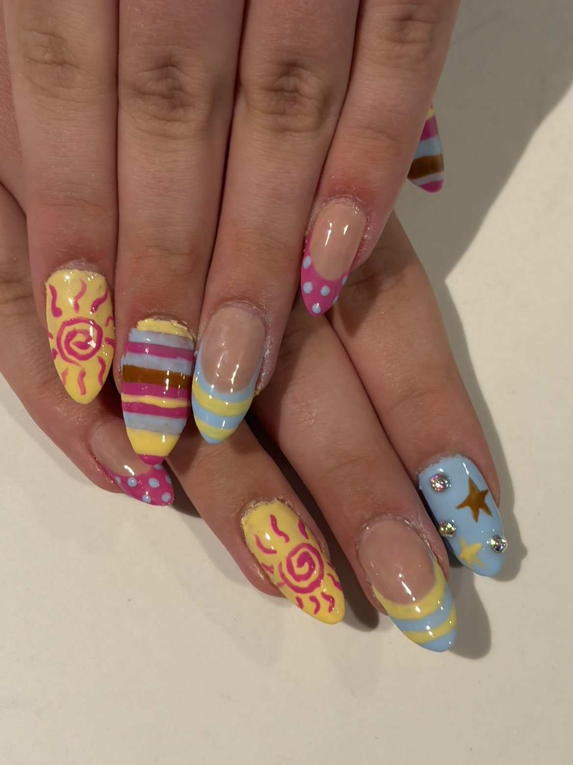 Summer sun and candy stripe nail art